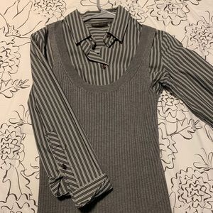 grey button up shirt with a grey tank top sweater